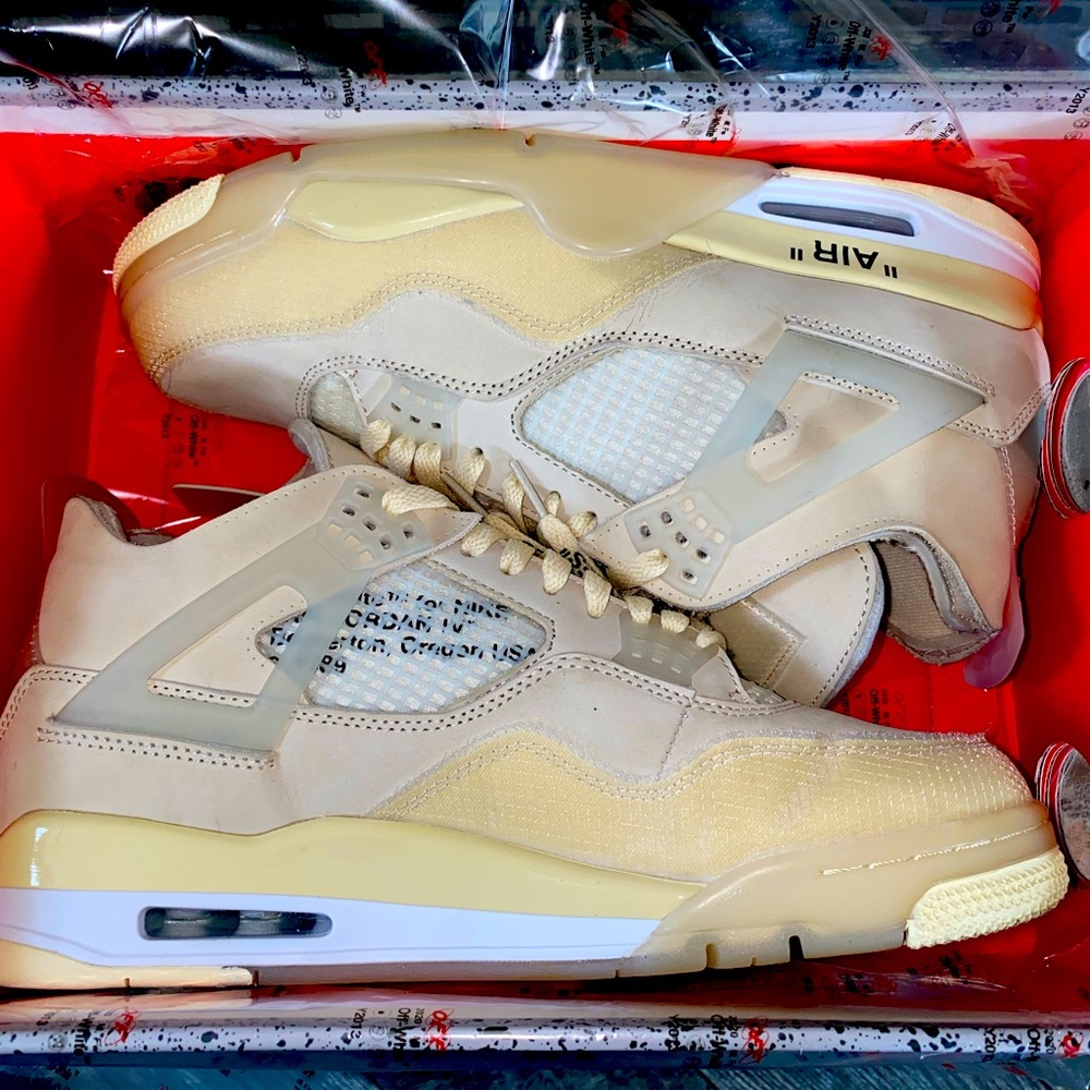 UA pair of JORDAN 4 Sails Off Whites.